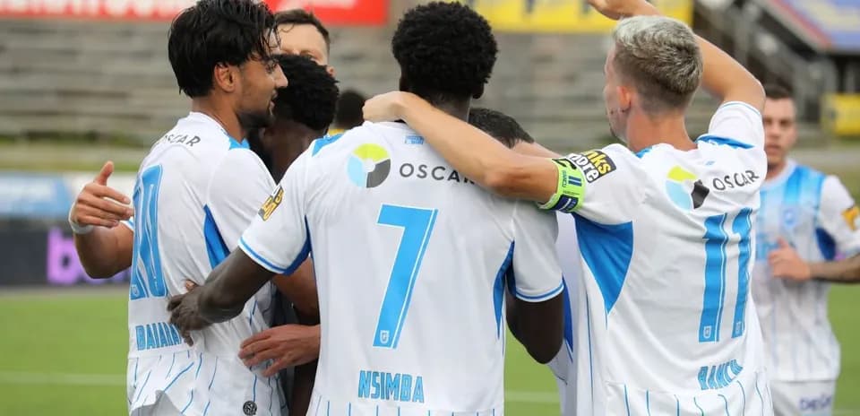 Players celebrating a goal during match