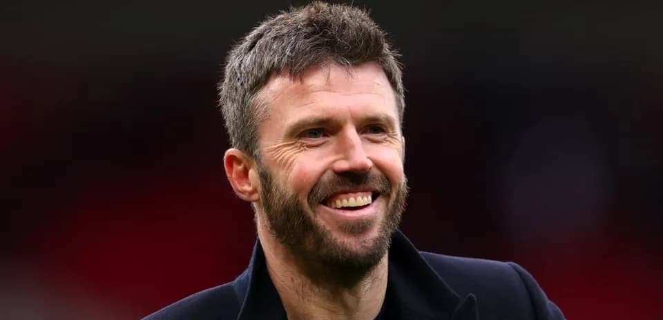 Man smiling in a sports venue