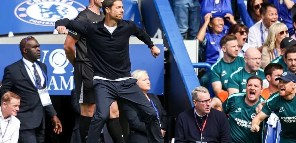 Manager celebrating on the sidelines during match