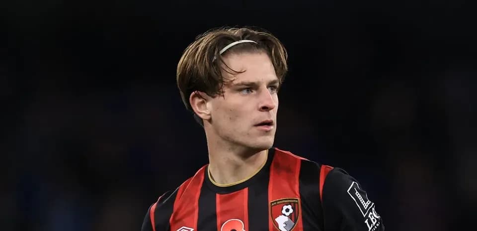 Bournemouth player in black and red jersey during match