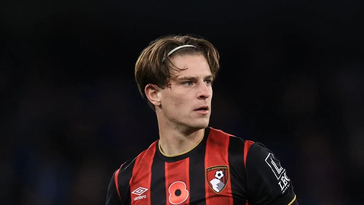 Bournemouth player in black and red jersey during match
