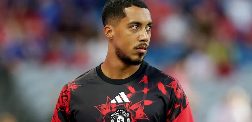 Player in Manchester United training jersey on field