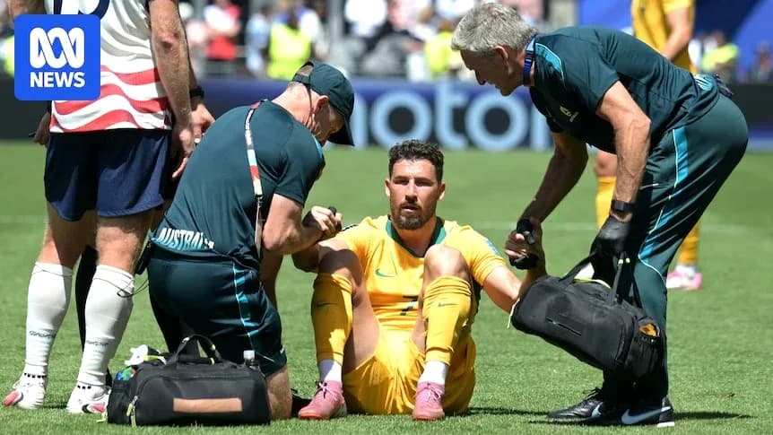 Player receiving medical attention on the field
