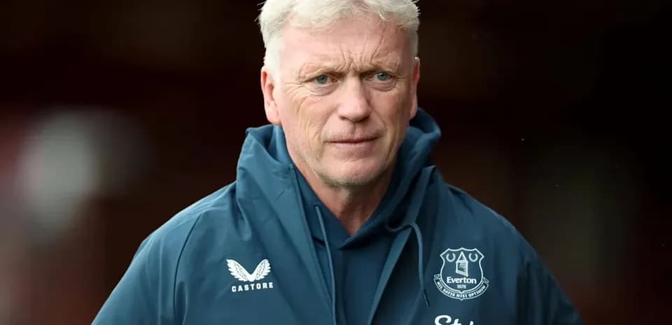 Manager wearing Everton jacket during match preparation