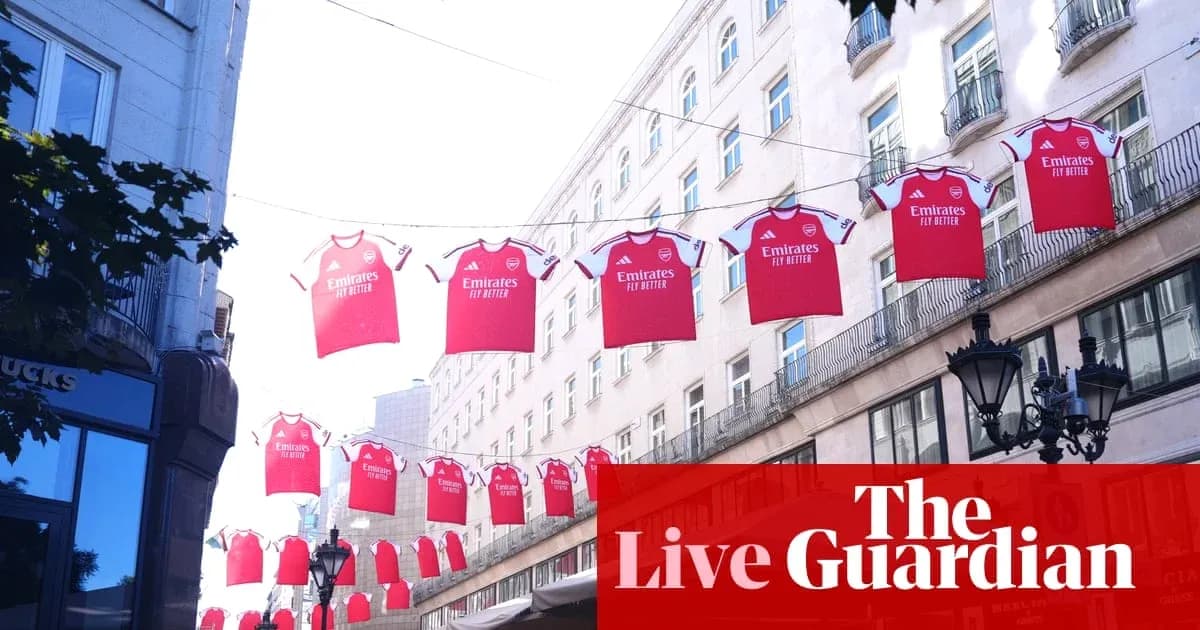 Arsenal jerseys hanging between buildings in city street