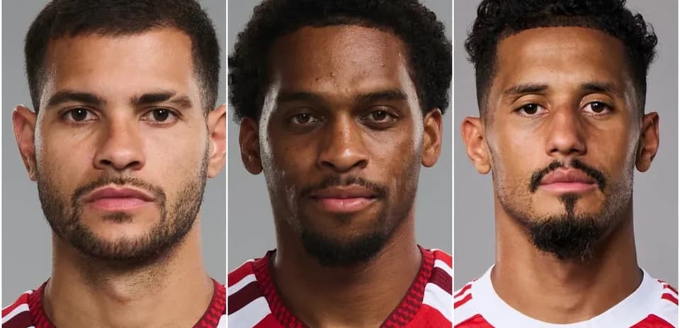 Three soccer players posing for official headshots