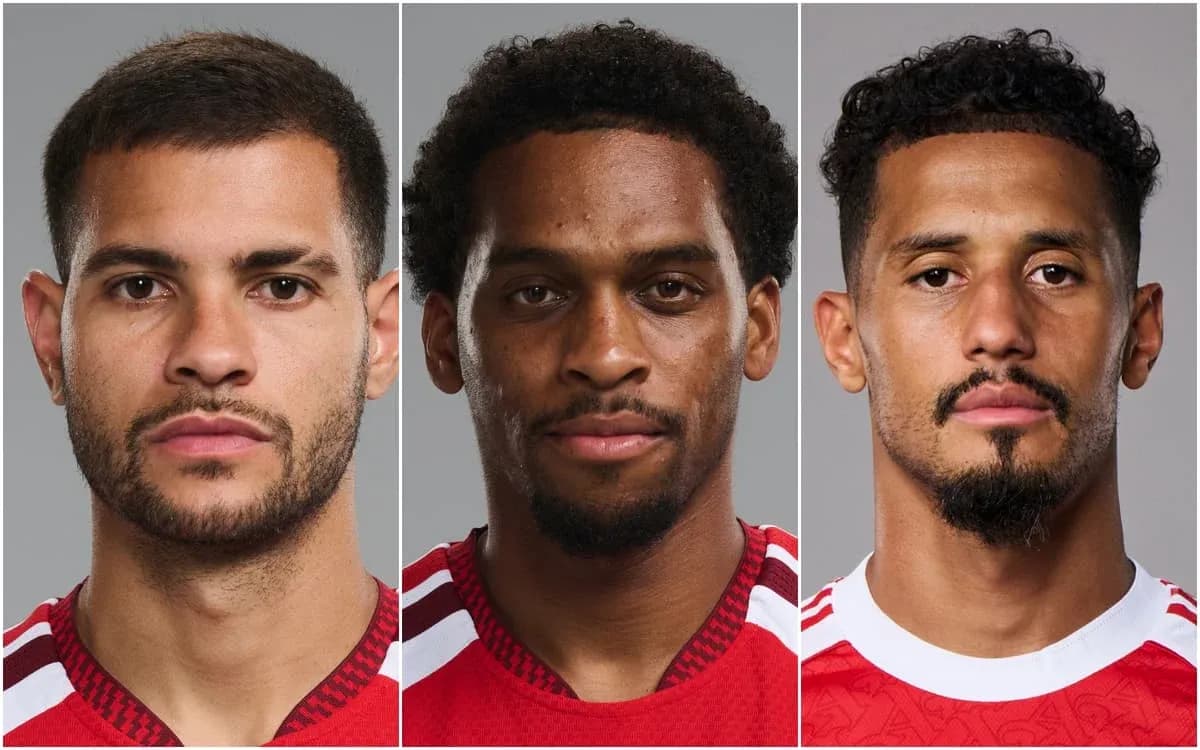 Three soccer players posing for official headshots