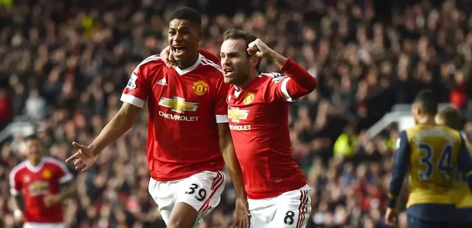 Two Manchester United players celebrating a goal