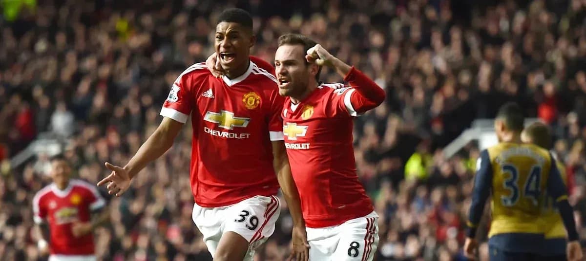 Two Manchester United players celebrating a goal Two Manchester United players celebrating a goal
