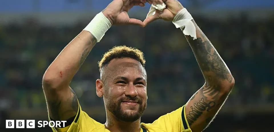 Neymar celebrating with heart gesture in Brazil jersey