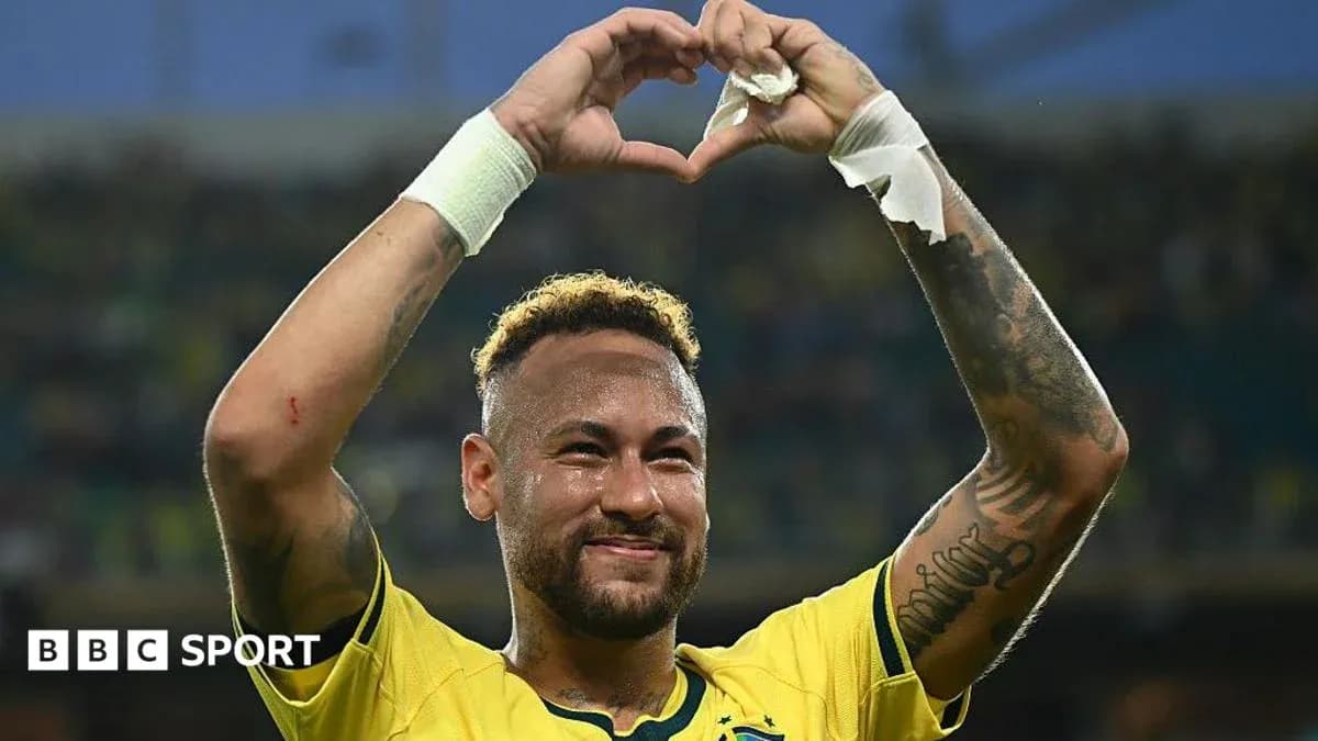 Neymar celebrating with heart gesture in Brazil jersey