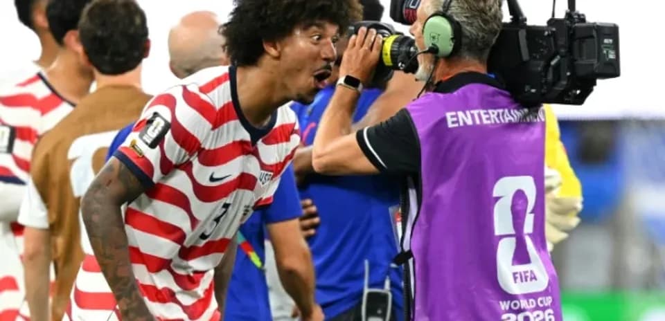 Player celebrating with camera after match