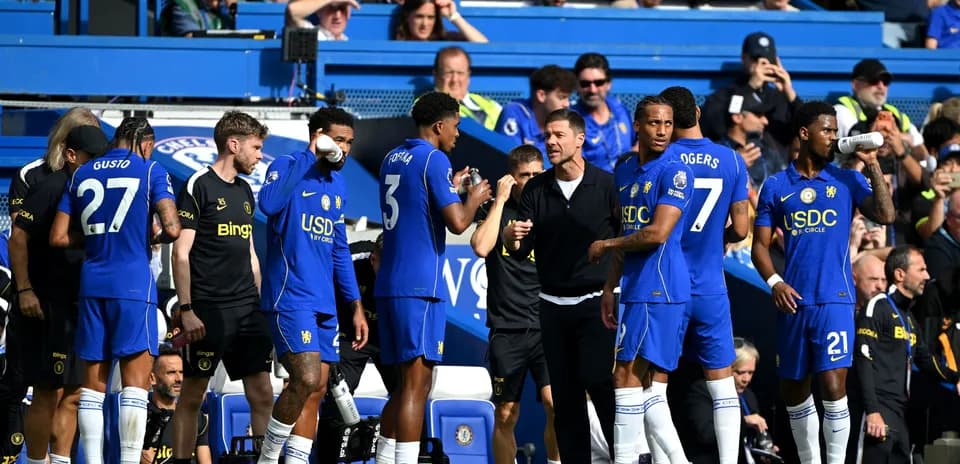 Chelsea players gathering on the sidelines during match
