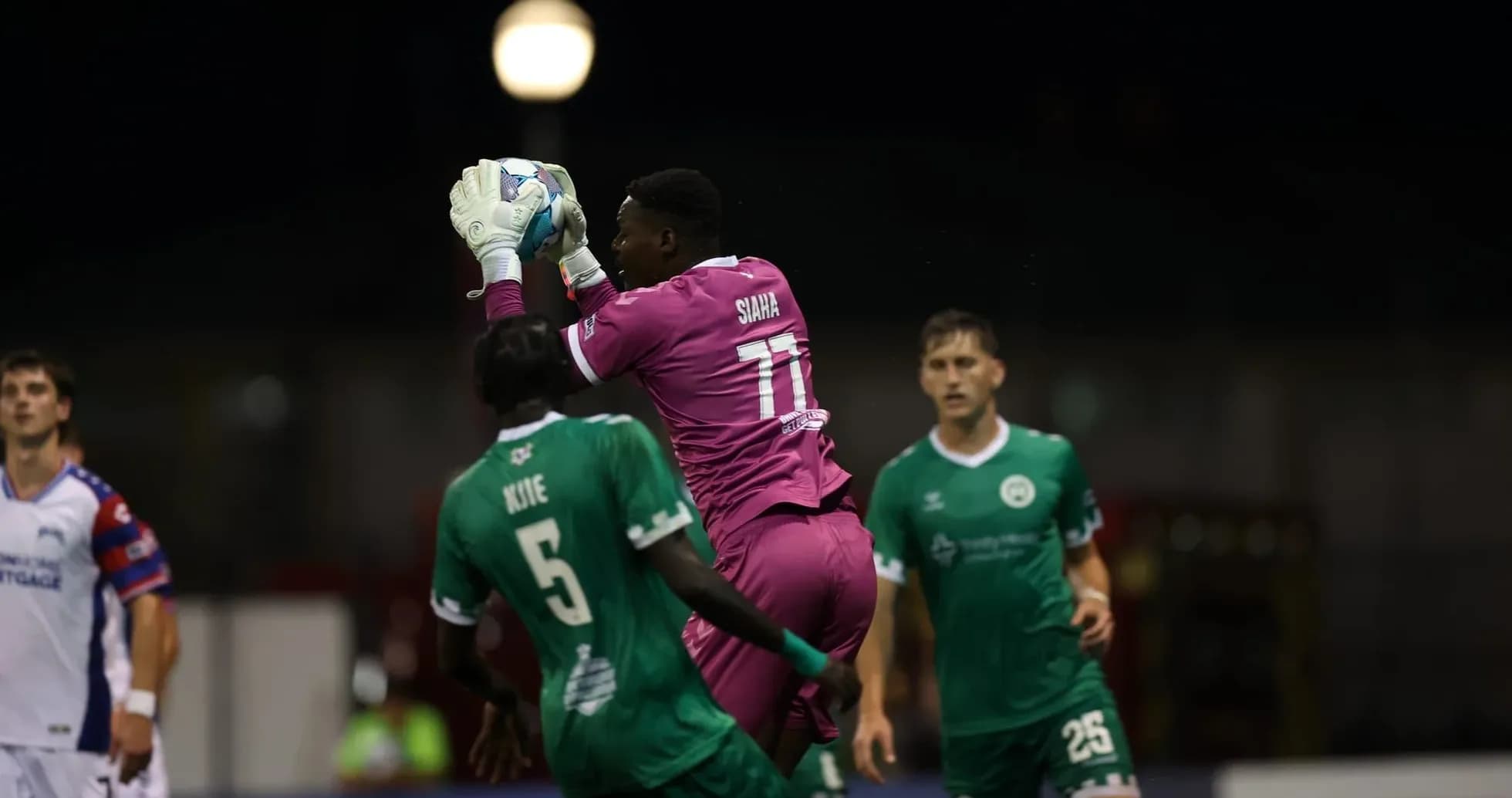 Goalkeeper catches ball during Tampa Bay Rowdies match