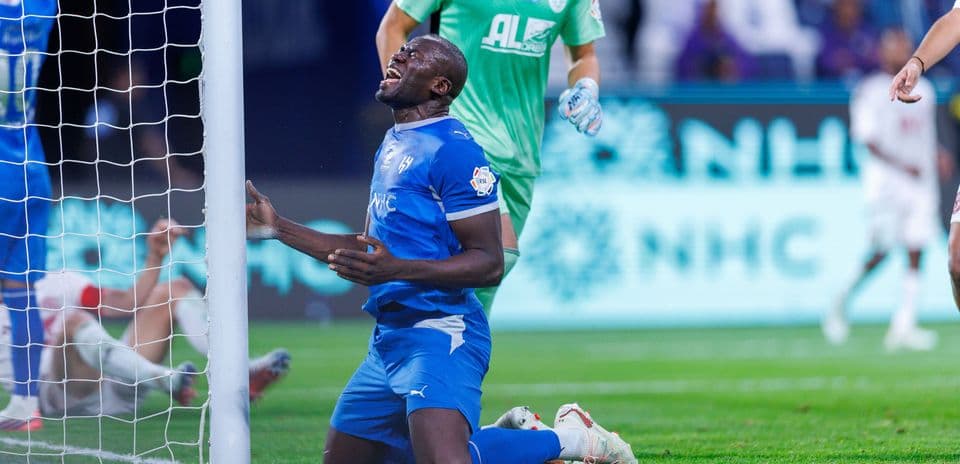 Player kneeling near goal after missed chance