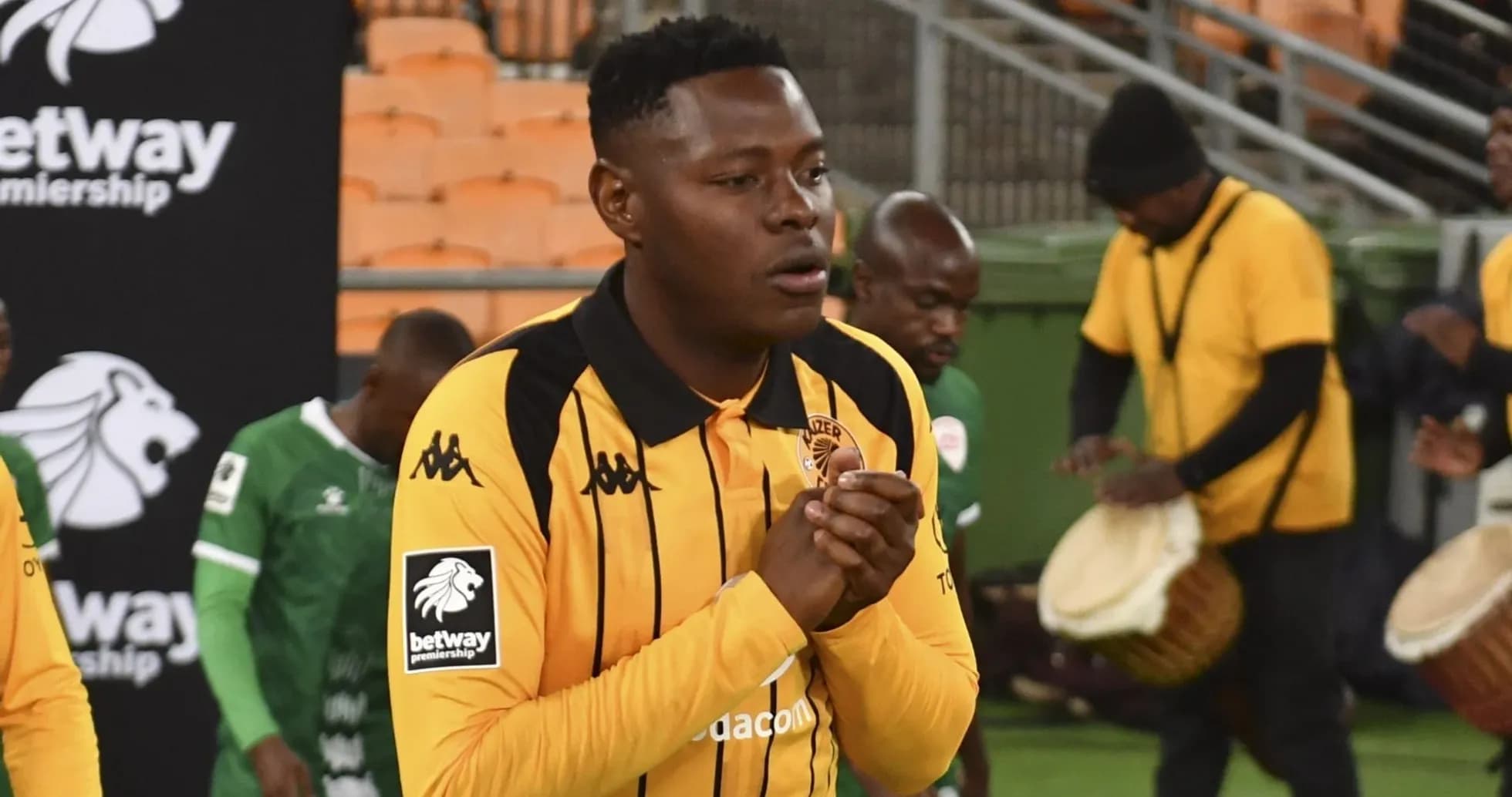 Player in yellow jersey preparing for match entrance