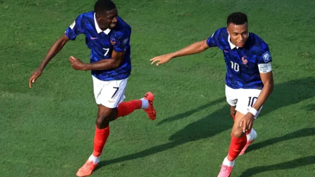 Two players celebrating a goal on the field