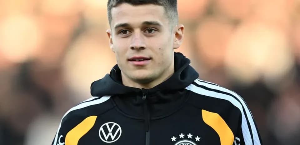 Player wearing Germany training jacket on field