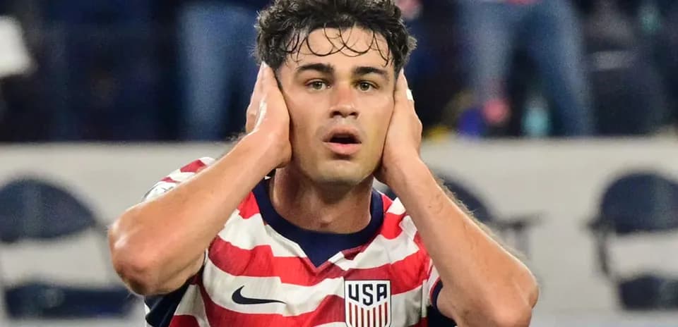 Player reacting during a match wearing USA jersey