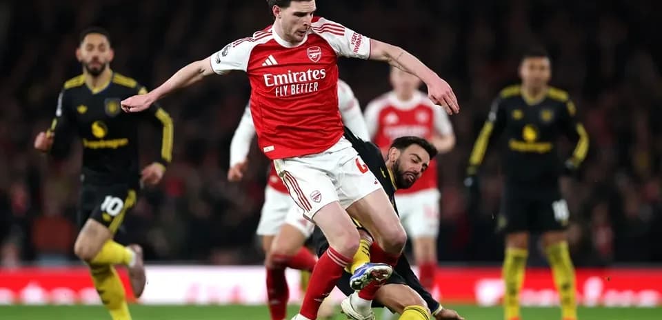 Player falling while tackling opponent during match