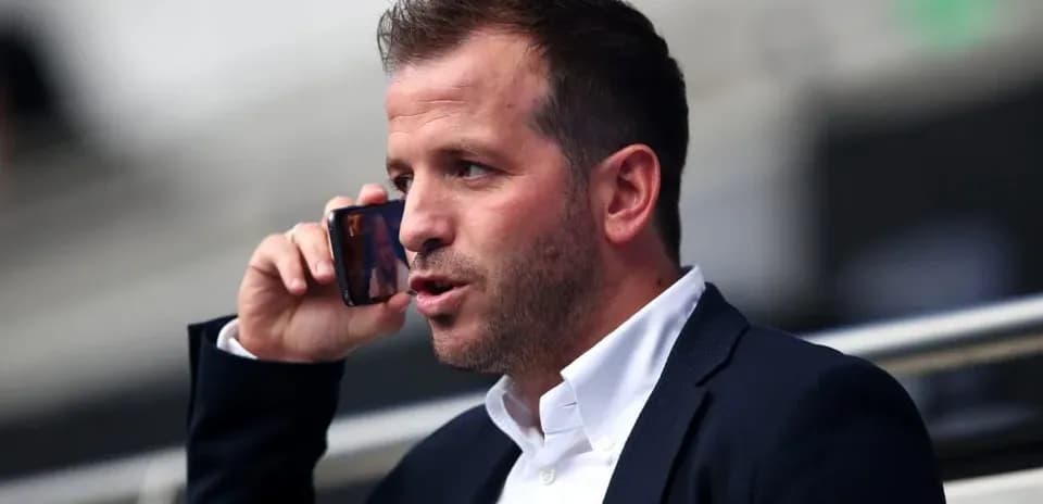 Man talking on the phone in stadium seating