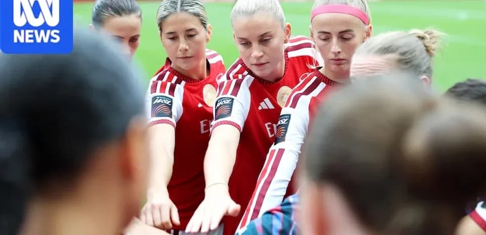 Players huddled together in team spirit before match