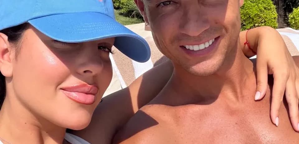 Couple posing for a selfie in a sunny setting