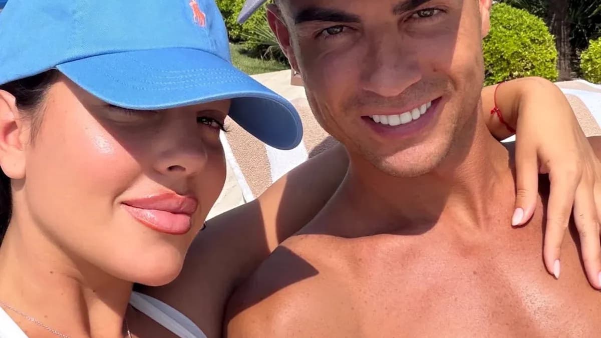 Couple posing for a selfie in a sunny setting