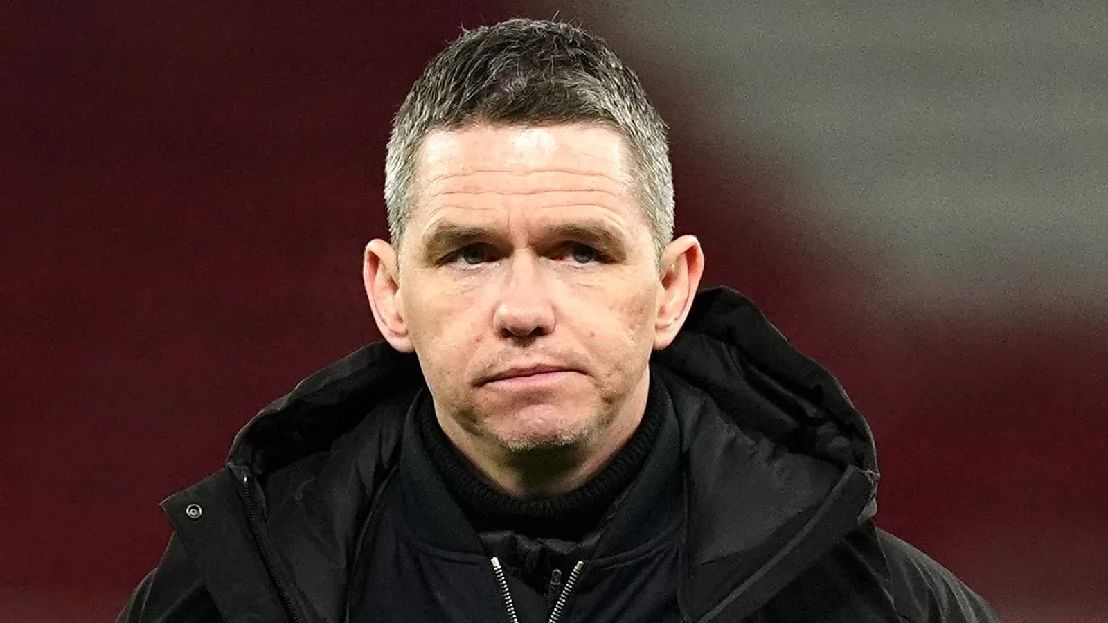 Coach observing during a football match