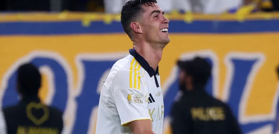 Player celebrating on the field after scoring