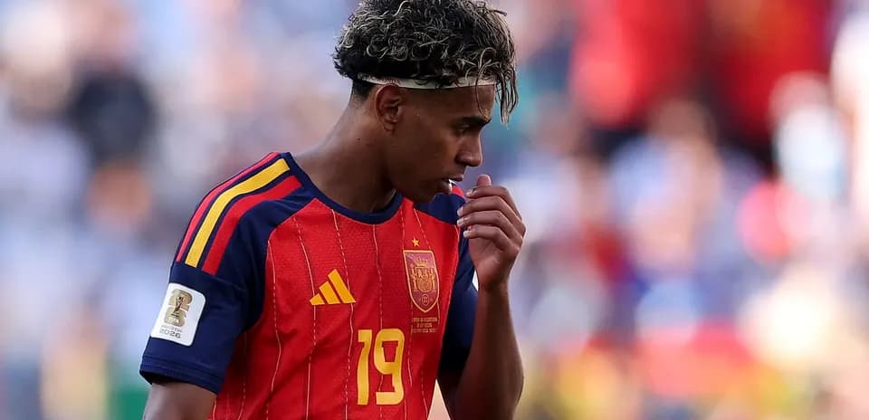 Player in Spain jersey looking down during match