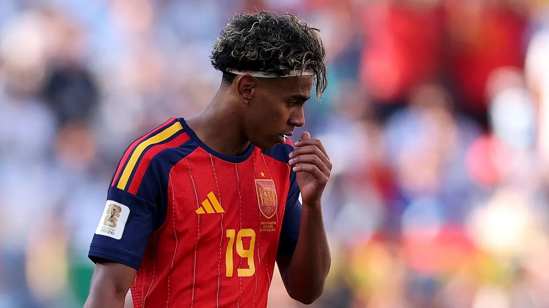 Player in Spain jersey looking down during match
