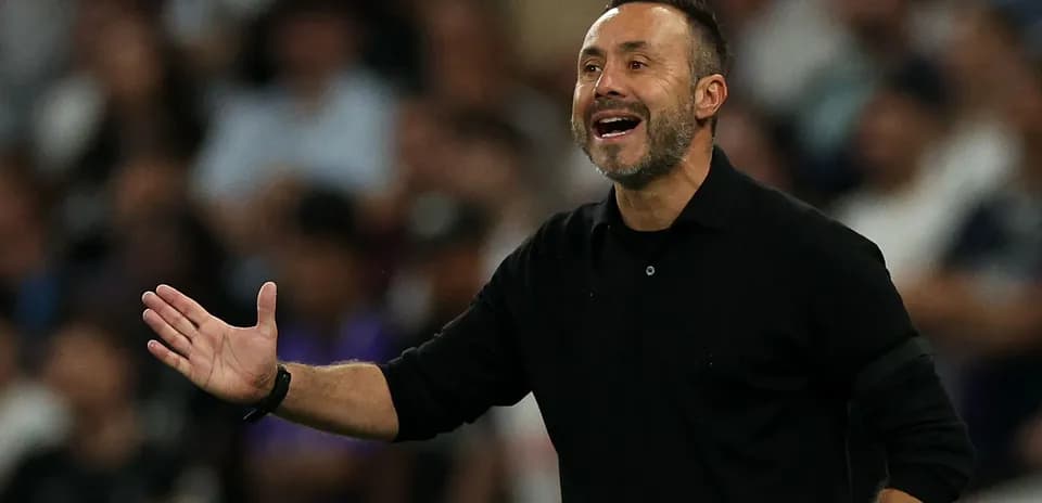 Coach gesturing during a match from the sidelines