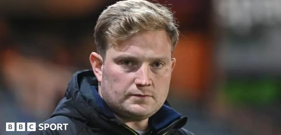 Coach looking serious during match preparation