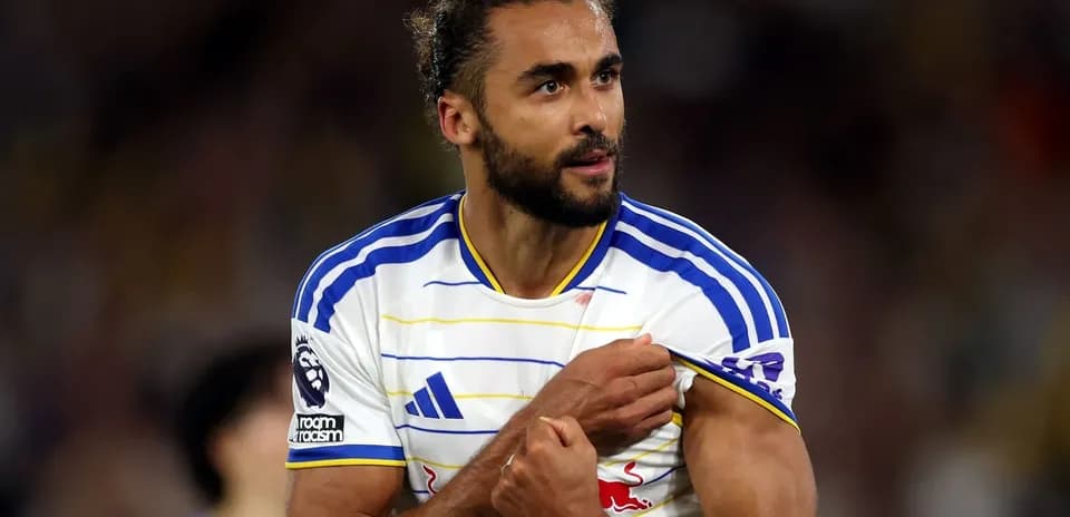 Player showing team badge on jersey during match