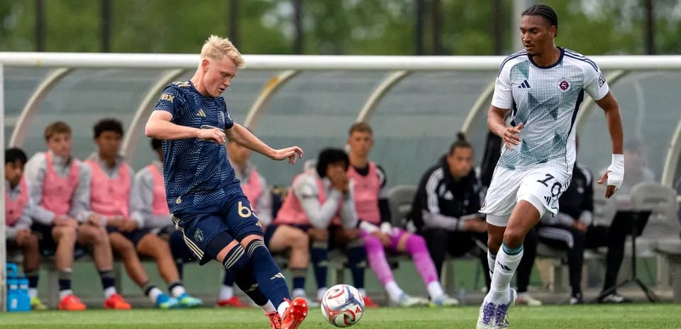 Players competing for the ball in MLS Next Pro