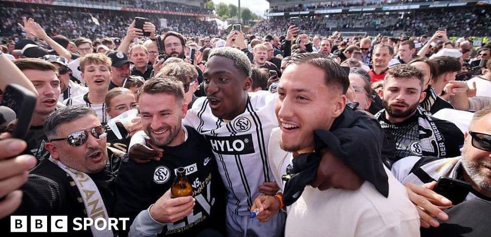 Fans celebrating with players after a match