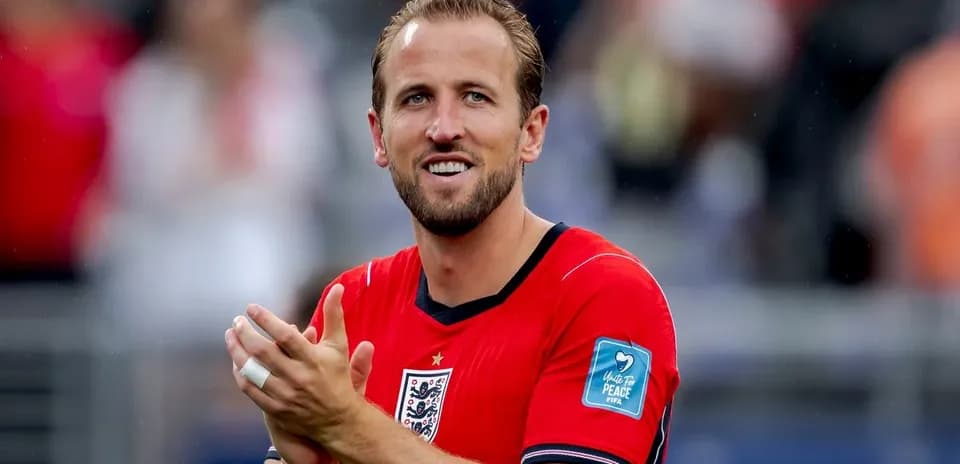 Player applauding while wearing red jersey