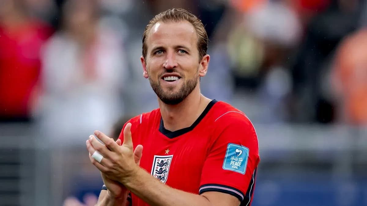 Player applauding while wearing red jersey