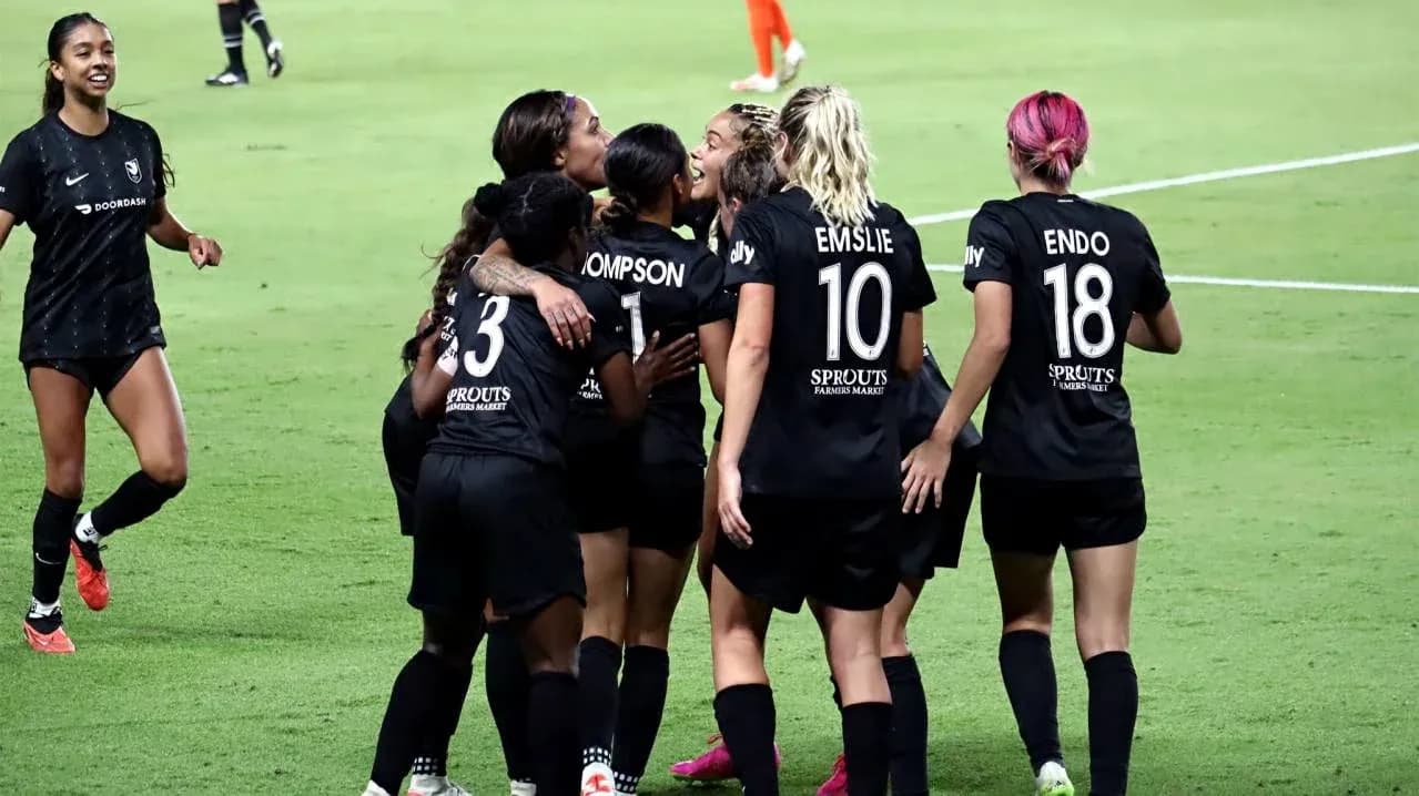 Players celebrating a goal during match