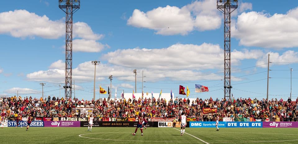 Fans cheering during Detroit City match