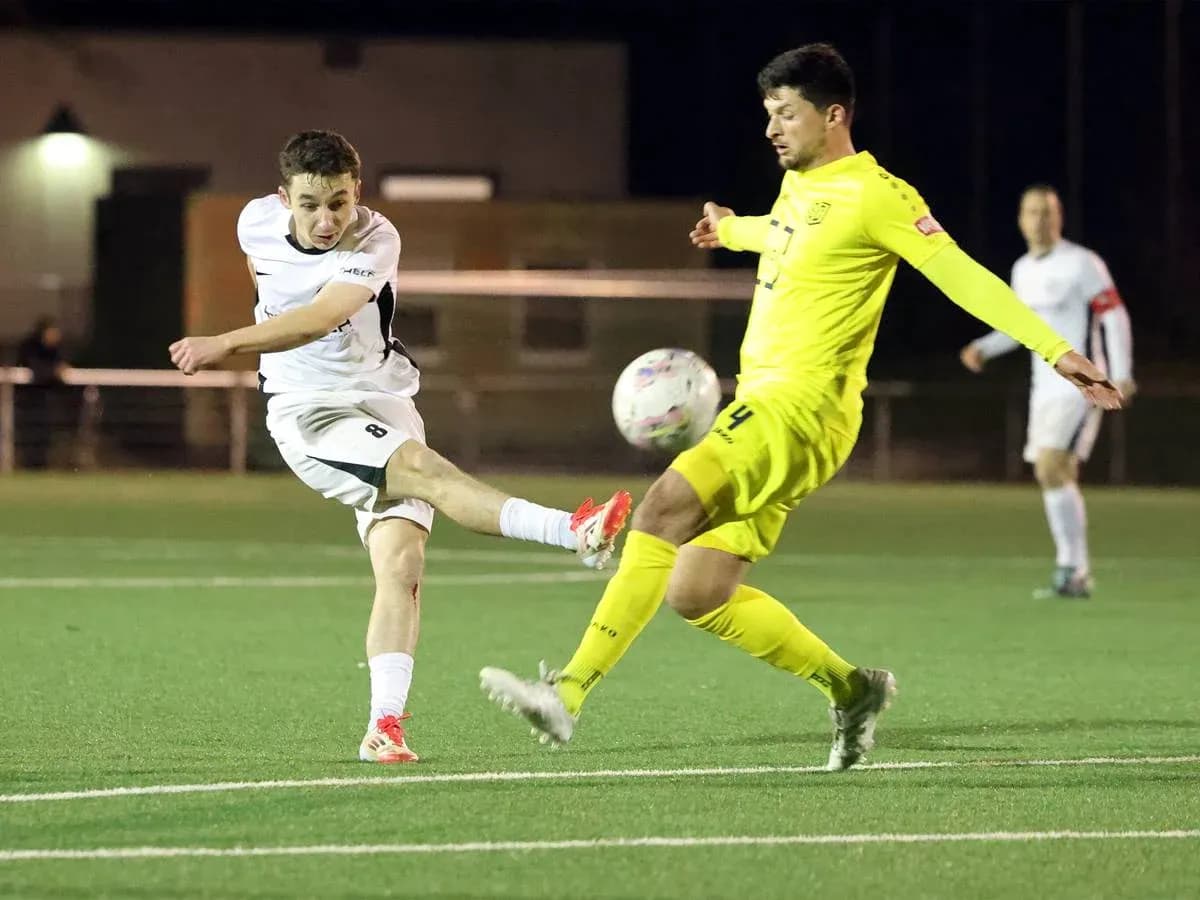 Player shooting the ball during match