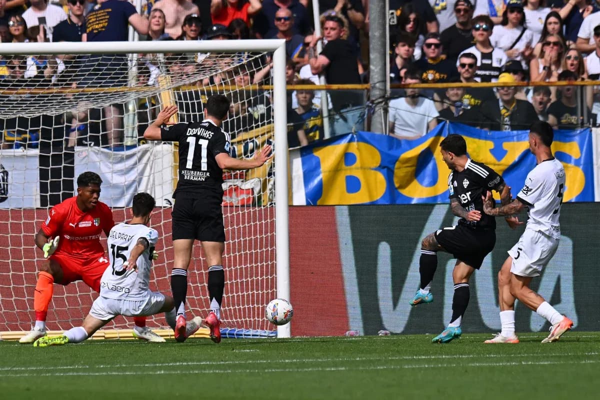 Player shooting on goal during Como vs Parma match