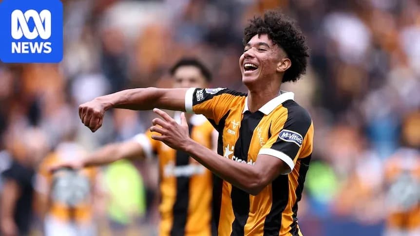 Player celebrating a goal in team colors