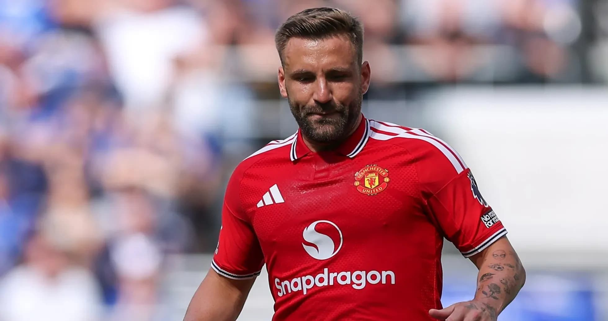 Player in red Manchester United jersey during match