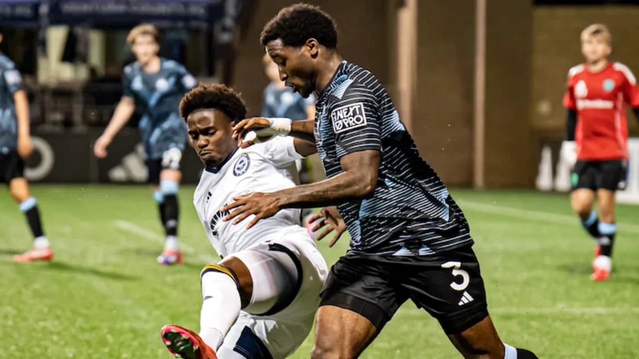 Players competing for the ball during match