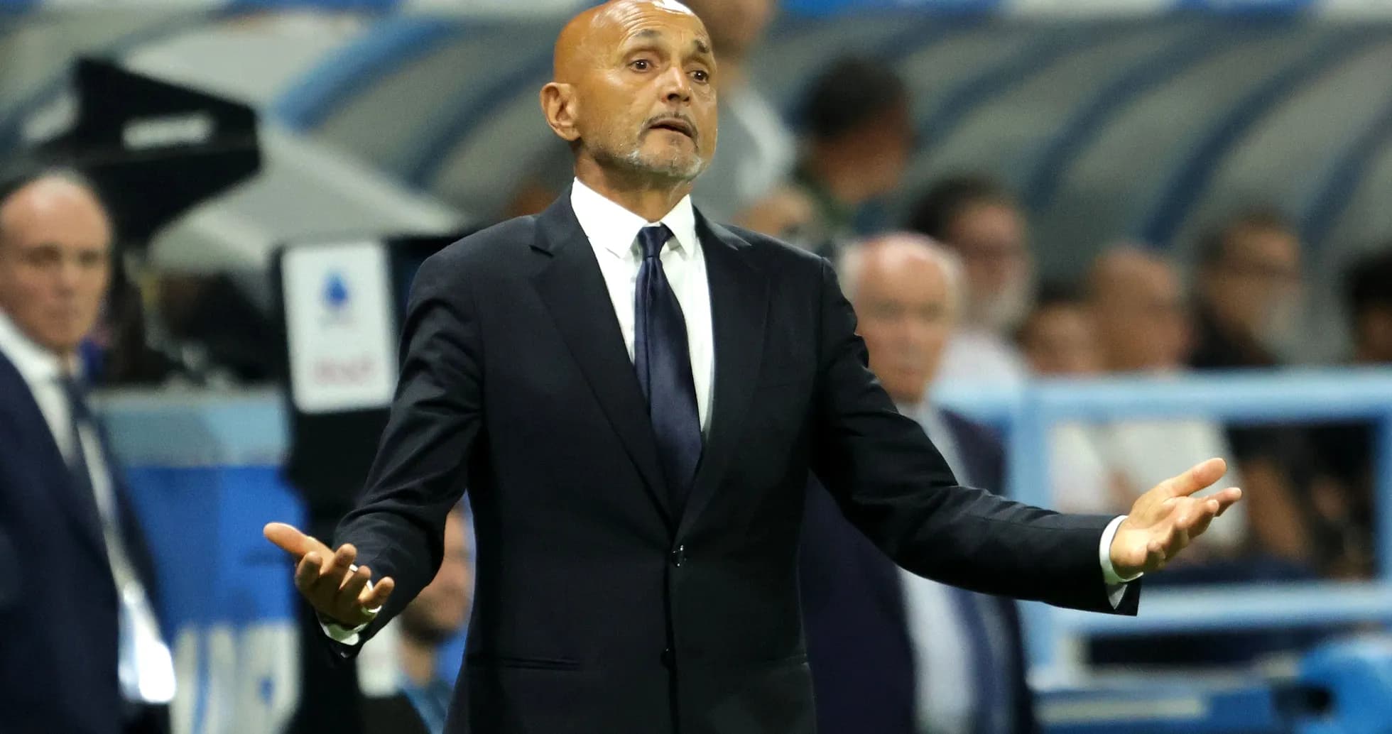 Coach gesturing during a match on the sideline