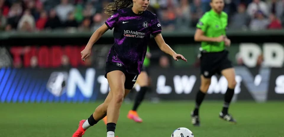 Player dribbling ball during NWSL match