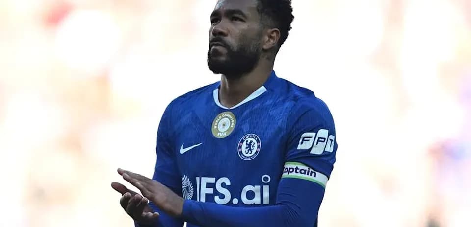 Player in blue Chelsea kit with captain's armband