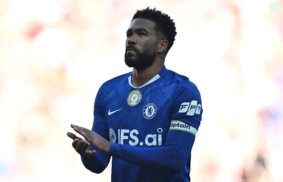 Player in blue Chelsea kit with captain's armband